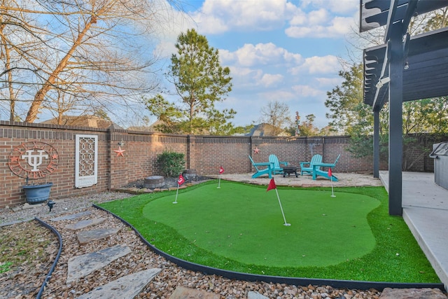 view of yard featuring a patio area and an outdoor fire pit