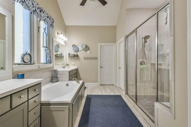 bathroom featuring ceiling fan, lofted ceiling, vanity, and separate shower and tub