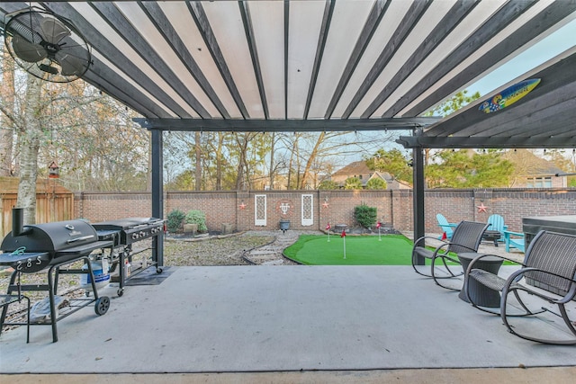 view of patio with area for grilling, ceiling fan, and a pergola