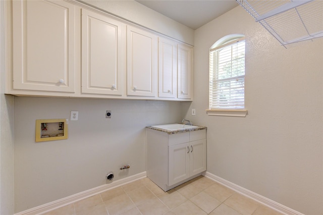 clothes washing area featuring hookup for a gas dryer, cabinets, washer hookup, light tile patterned floors, and electric dryer hookup