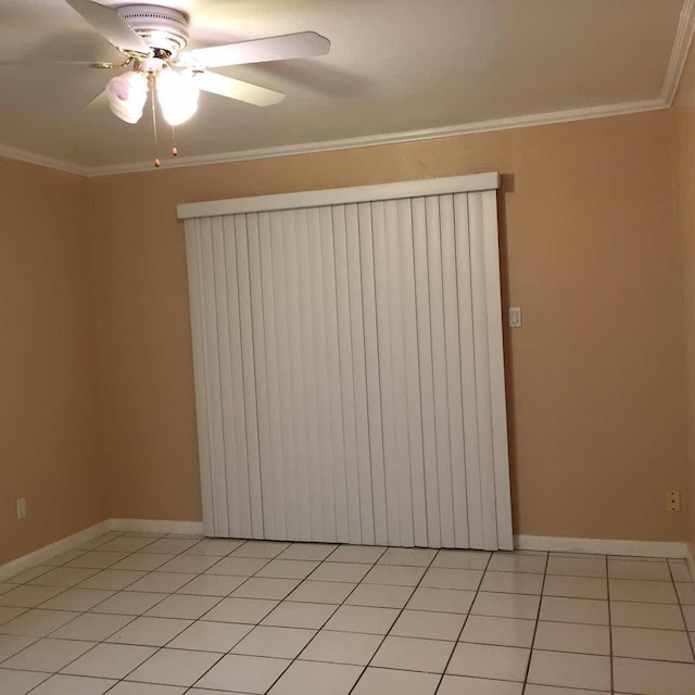 tiled empty room featuring radiator, crown molding, and ceiling fan