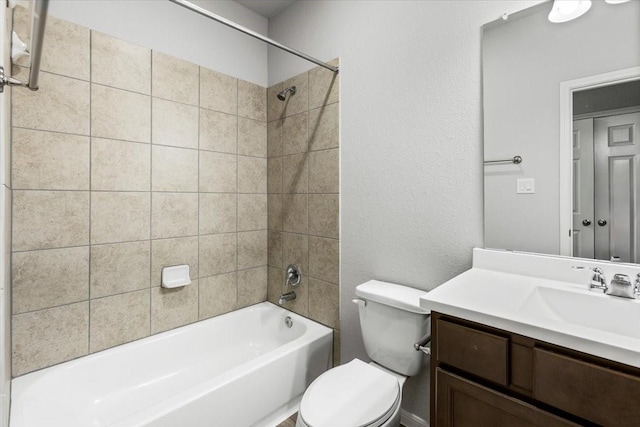 bathroom with vanity, toilet, and bathtub / shower combination