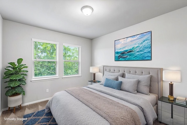 bedroom featuring carpet flooring and baseboards