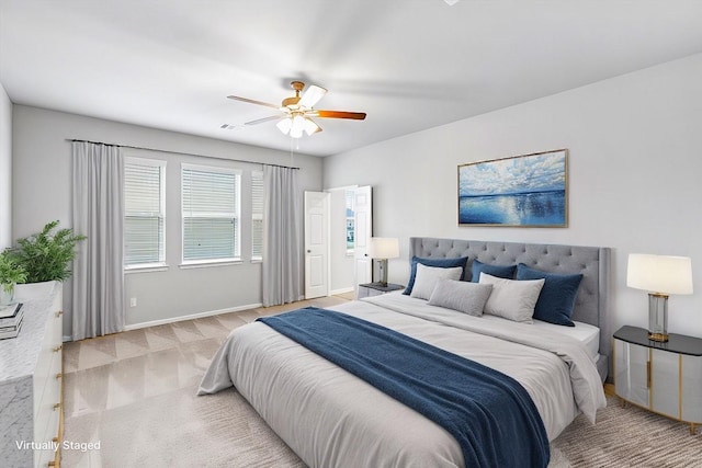 bedroom with carpet, visible vents, a ceiling fan, and baseboards