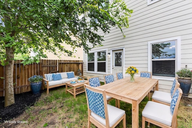 exterior space with fence and an outdoor hangout area