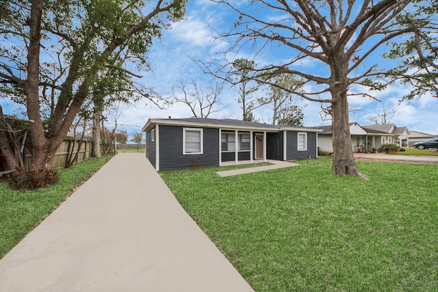 ranch-style house with a front yard