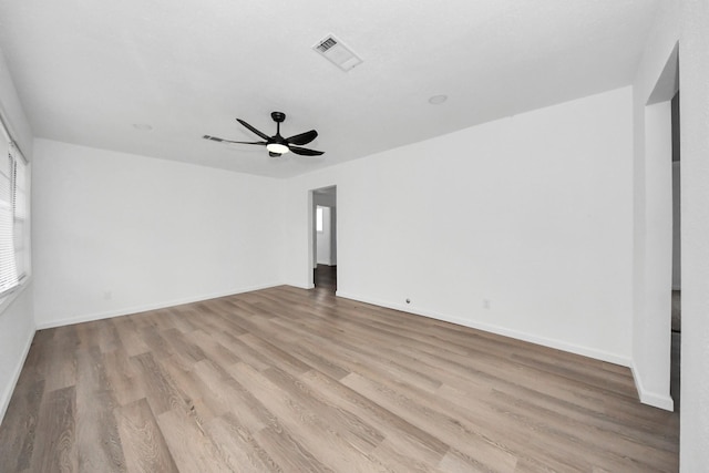 spare room featuring light hardwood / wood-style flooring and ceiling fan