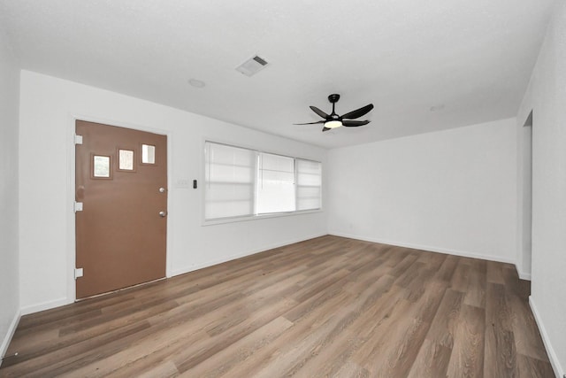 interior space featuring ceiling fan, plenty of natural light, and hardwood / wood-style floors