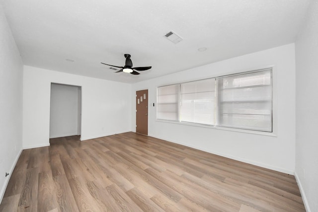 unfurnished room featuring ceiling fan and light hardwood / wood-style flooring