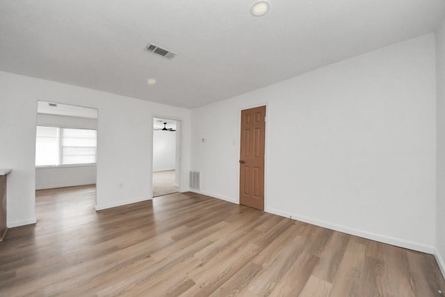 unfurnished room featuring light hardwood / wood-style floors