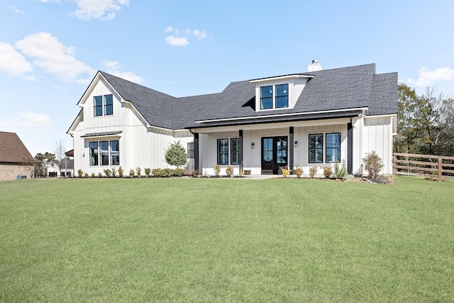 modern farmhouse style home featuring a porch and a front yard