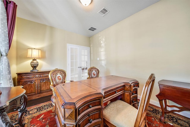 office space featuring french doors, a textured ceiling, and hardwood / wood-style flooring