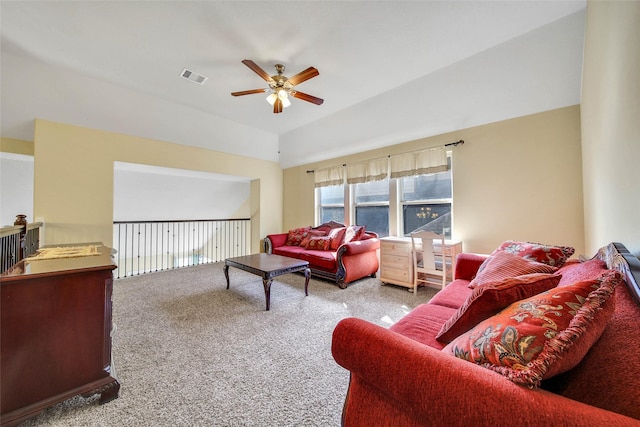 living room featuring lofted ceiling, light carpet, and ceiling fan