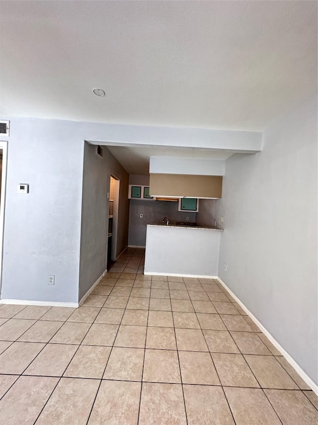 kitchen with light tile patterned floors