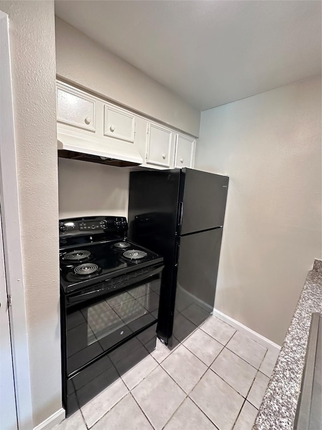 kitchen with light tile patterned floors, black appliances, and white cabinets