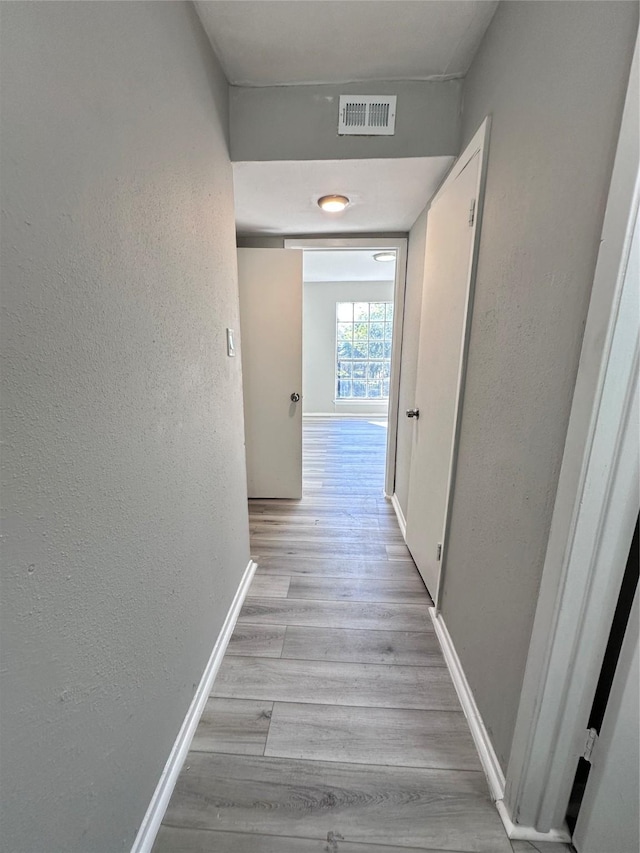 hallway featuring light hardwood / wood-style floors