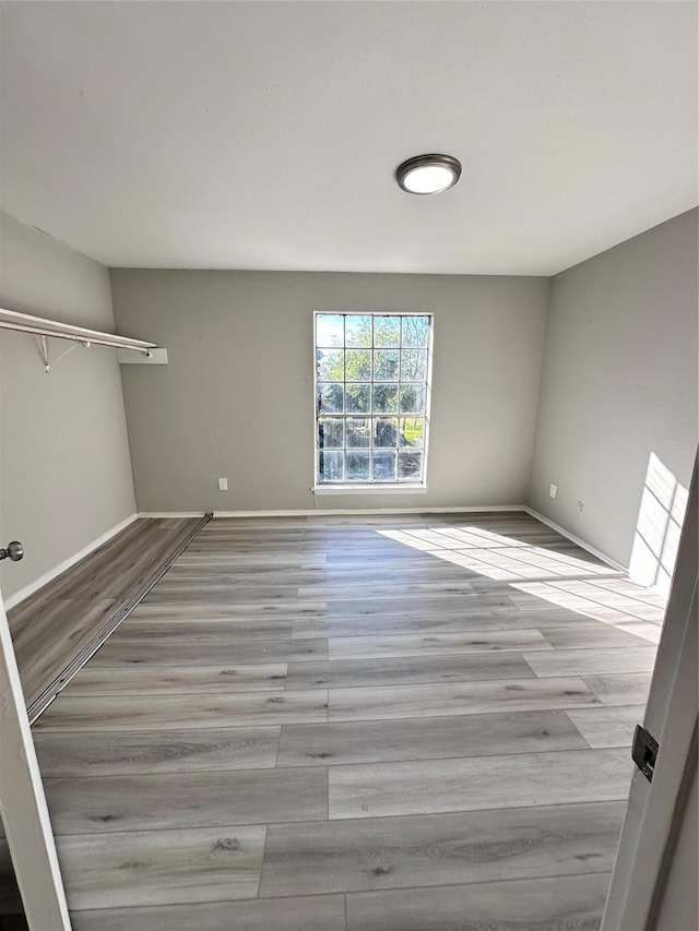 spare room featuring light wood-type flooring