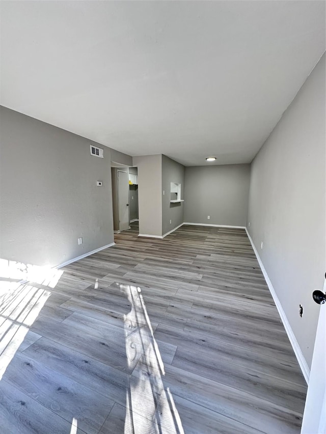 unfurnished living room with hardwood / wood-style floors