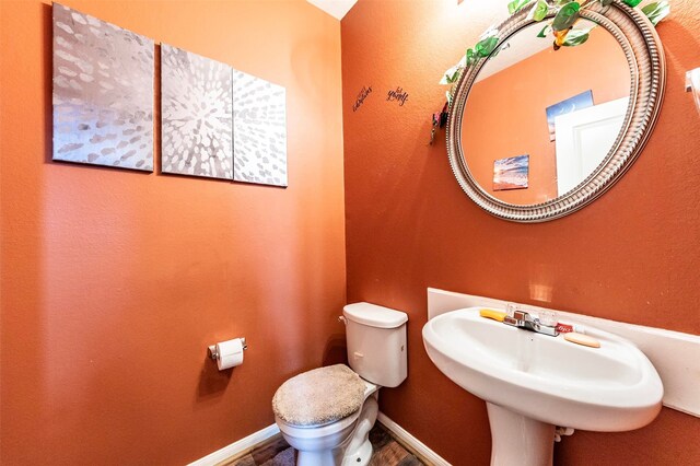 bathroom featuring sink and toilet