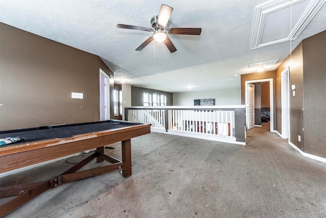 rec room with a textured ceiling