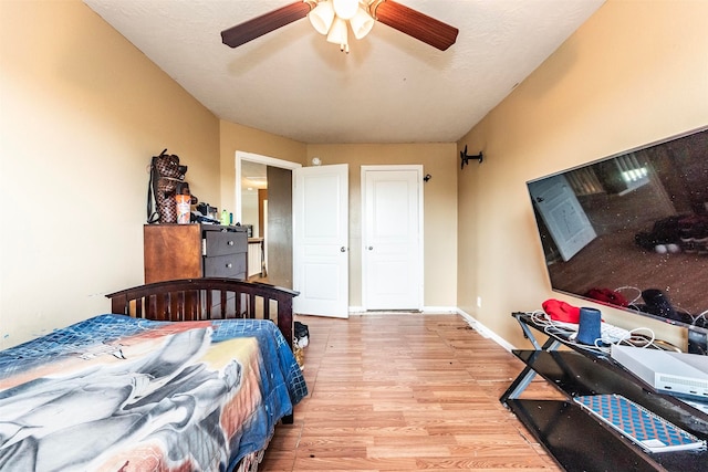 bedroom featuring ceiling fan and light hardwood / wood-style flooring