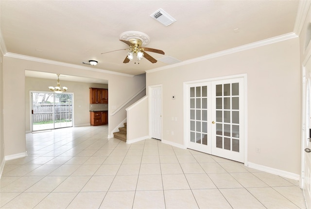 spare room featuring crown molding, french doors, and light tile patterned floors