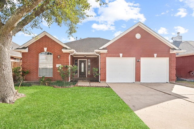 view of front of home with a garage and a front yard