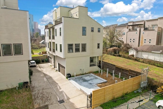 rear view of house with a garage