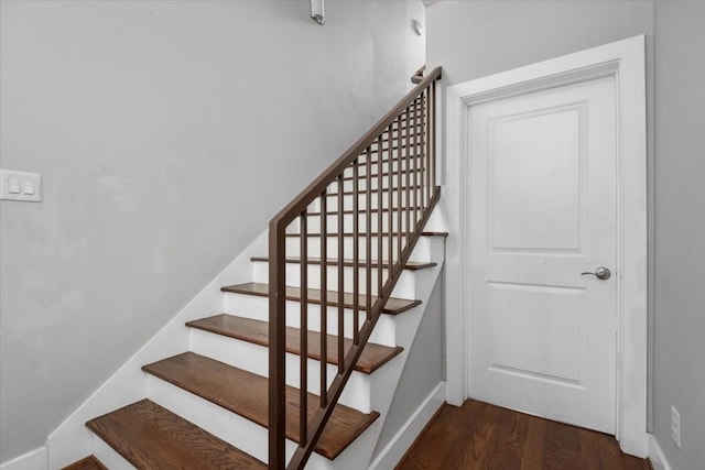 stairs featuring wood-type flooring