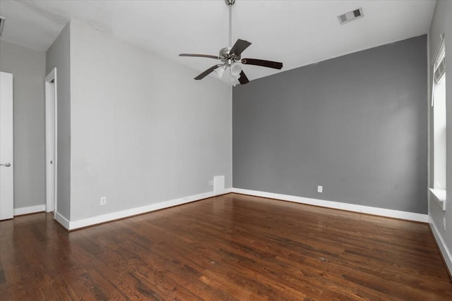 unfurnished room featuring ceiling fan and dark hardwood / wood-style flooring