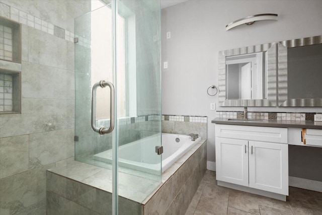 bathroom with vanity, tile patterned flooring, and separate shower and tub