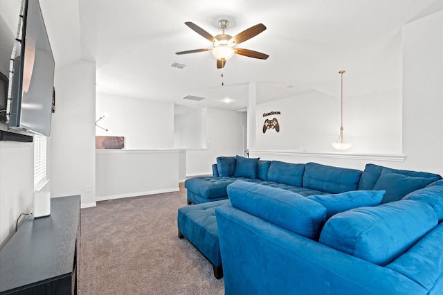 carpeted living room featuring ceiling fan