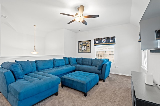 living room featuring ceiling fan, lofted ceiling, and carpet floors