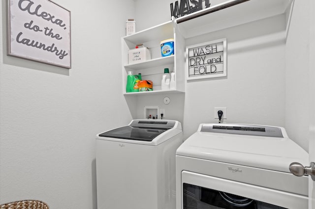 laundry area with washing machine and clothes dryer