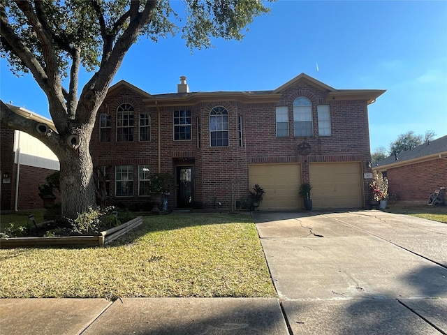 view of front of property featuring a garage and a front lawn