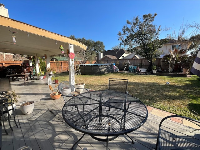 view of patio with a fenced in pool