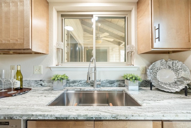 details with ceiling fan, sink, and light stone counters