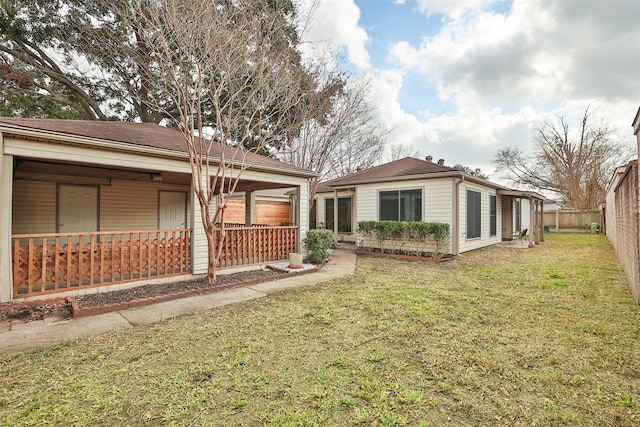 exterior space with a porch and a yard