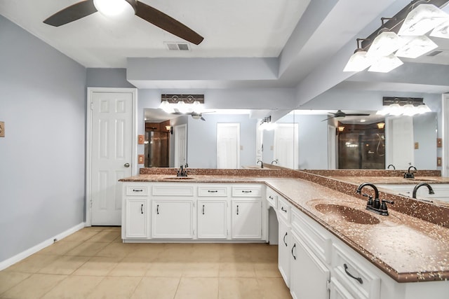 bathroom with vanity, tile patterned floors, ceiling fan, and walk in shower