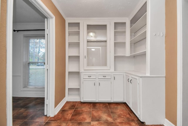 walk in closet with dark tile patterned flooring