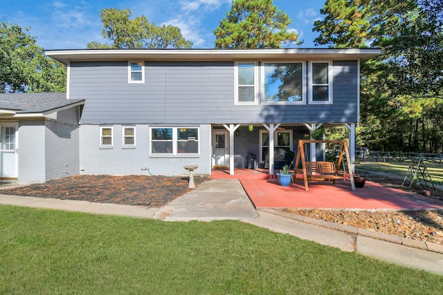 view of front of property with a front lawn and a patio area