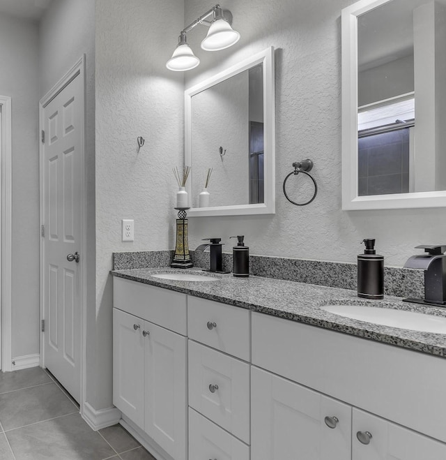 bathroom with tile patterned flooring and vanity