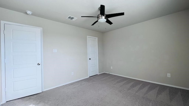 unfurnished room featuring carpet floors and ceiling fan