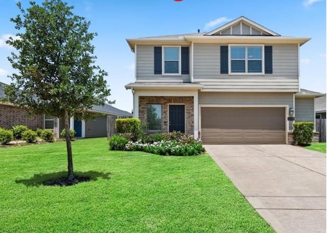 view of front of house with a garage and a front yard