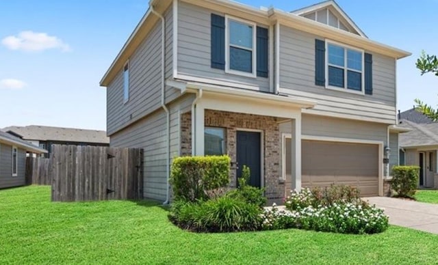 view of front of house with a garage and a front lawn