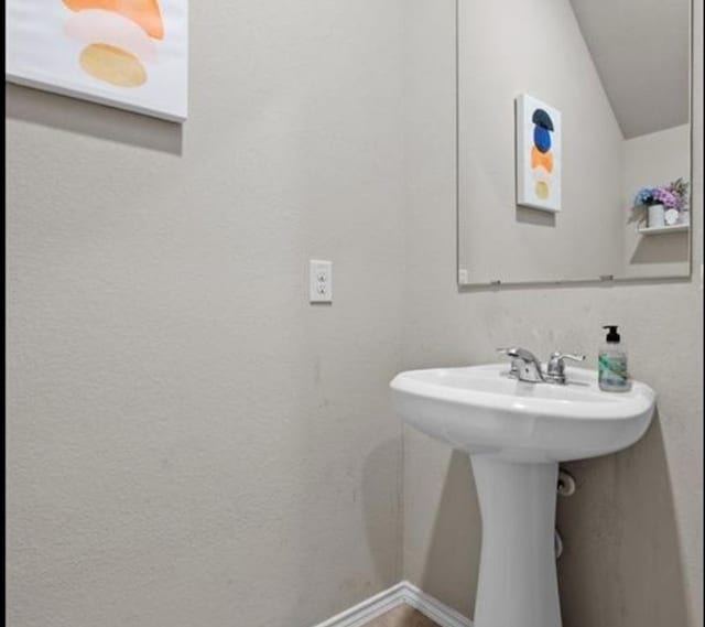 bathroom with vaulted ceiling