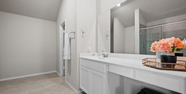 bathroom with vanity, an enclosed shower, and tile patterned floors