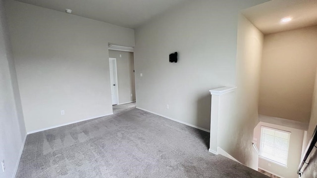 empty room with light colored carpet