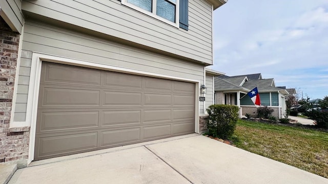 garage with a lawn