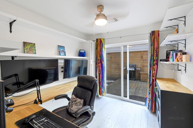 office featuring hardwood / wood-style flooring and ceiling fan